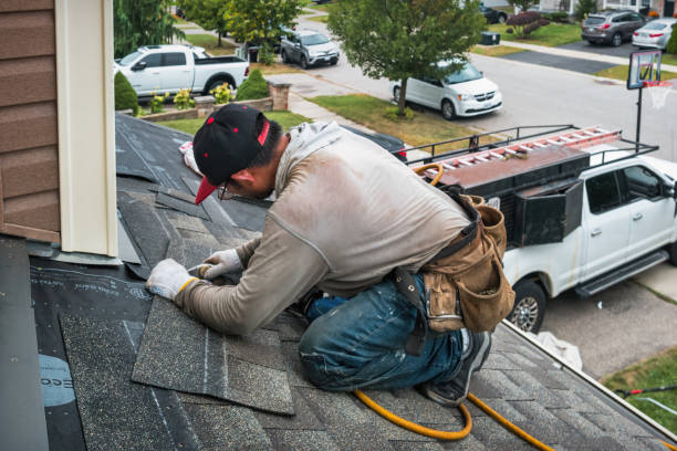 Professional Roof Replacement technician working in Maysville, OK